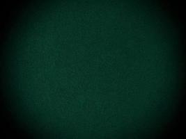 Dark green old velvet fabric texture used as background. Empty green fabric background of soft and smooth textile material. There is space for text... photo