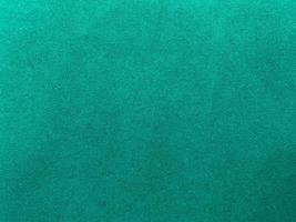 Dark green old velvet fabric texture used as background. Empty green fabric background of soft and smooth textile material. There is space for text.. photo