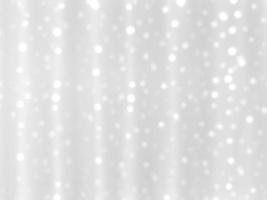 Abstract white blurred bokeh light on soft light background.In concept Christmas or New Year holiday card template. Magic falling snow backdrop. photo