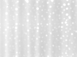 Abstract white blurred bokeh light on soft light background.In concept Christmas or New Year holiday card template. Magic falling snow backdrop. photo