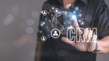 CRM Customer Relationship Management for business sales marketing system concept presented in futuristic graphic interface of service application to support CRM database analysis. photo