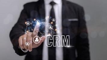 CRM Customer Relationship Management for business sales marketing system concept presented in futuristic graphic interface of service application to support CRM database analysis. photo
