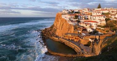 Azenhas do Mar, Portugal. Natural pool in the ocean, next to the cliff and a seaside village during sunset. Best destinations in the world. Most visited places. Holidays. Scenic and exotic. video