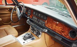 Close up view of front part of luxury old retro automobile photo