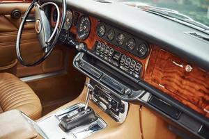 Close up view of front part of luxury old retro automobile photo