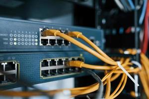 Close up view of internet equipment and cables in the server room photo