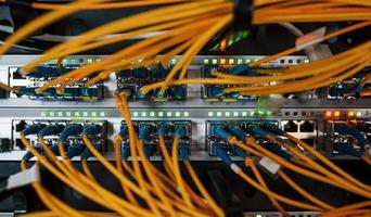 Close up view of internet equipment and cables in the server room photo