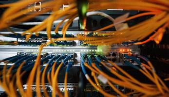 Close up view of internet equipment and cables in the server room photo