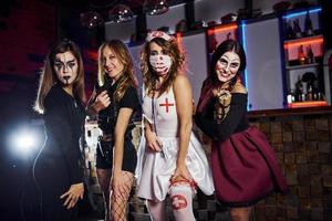 Friends is on the thematic halloween party in scary makeup and costumes photo