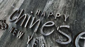 Happy Chiness New Year chrome text on wood video