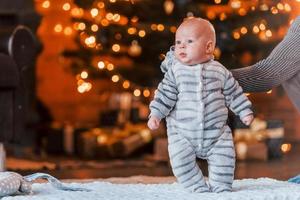 Mother with her child together in christmas decorated room photo