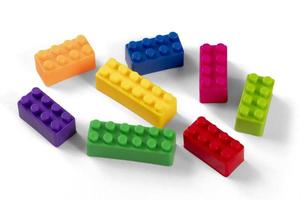 Colorful plastic building block patterns isolated. Toy for children photo