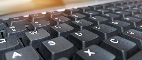 Close-up side view of black keyboard photo