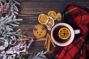 Cup with tea. Top view of christmas festive frame with new year decorations photo