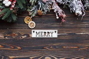 Table with merry word. Top view of christmas festive frame with new year decorations photo