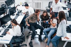 Young business people working together in the modern office photo