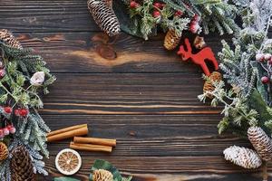 Dry orange lying on the surface. Top view of christmas festive frame with new year decorations photo