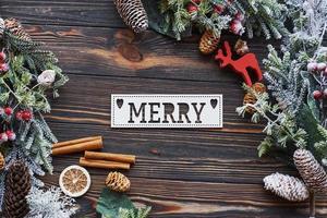 Table with merry word. Top view of christmas festive frame with new year decorations photo