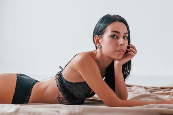 Sensual beautiful woman in a sensual underwear relaxing at home