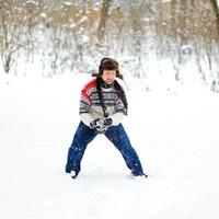 man playing snowballs photo