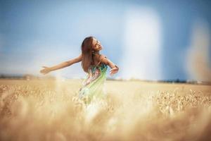 girl in wheat meadow photo