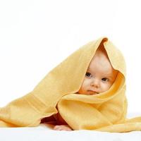 baby in yellow towel photo