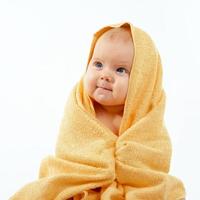 baby in yellow towel photo