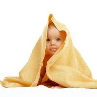 baby in yellow towel photo