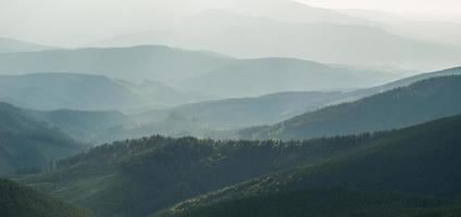 View of misty fog mountains in autumn photo