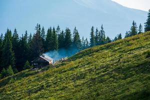 mountain valley and old wood shack photo