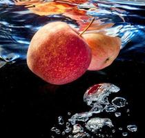 two apple in water photo