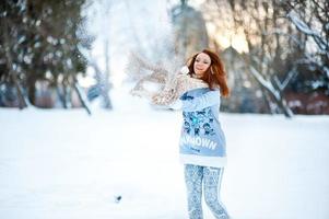 Girl in snowy forest photo