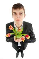 Businessman offering tulip photo