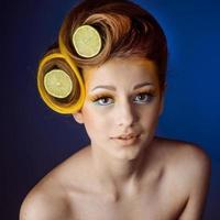 woman with fruit in hair photo