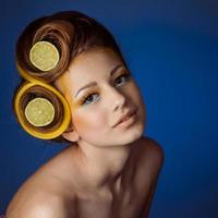 woman with fruit in hair photo