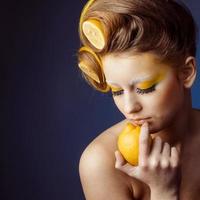 woman with fruit in hair photo