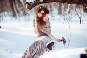 beautiful girl in the winter forest photo