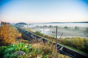 Train tracks swamp landscape photo