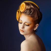 woman with fruit in hair photo