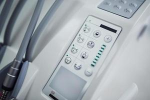 Close up view of medical chair's control panel with buttons photo