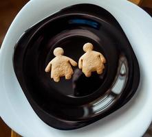 Pile of cookies on a black plate photo