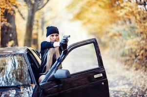 Sexy blonde girl with weapon photo