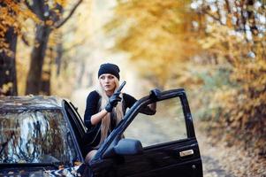 Sexy blonde girl with weapon photo