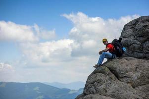 tourist on rock photo