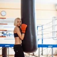 Pretty sport woman with boxing gloves photo