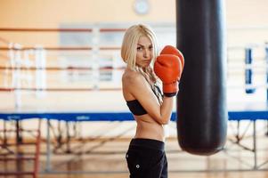 Pretty sport woman with boxing gloves photo