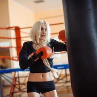 Pretty sport woman with boxing gloves photo