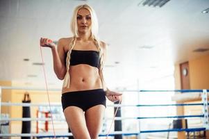 Portrait of young female boxer photo