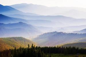 View of misty fog mountains in autumn photo