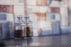 Glasses with dry products standing on the table indoors in kitchen photo